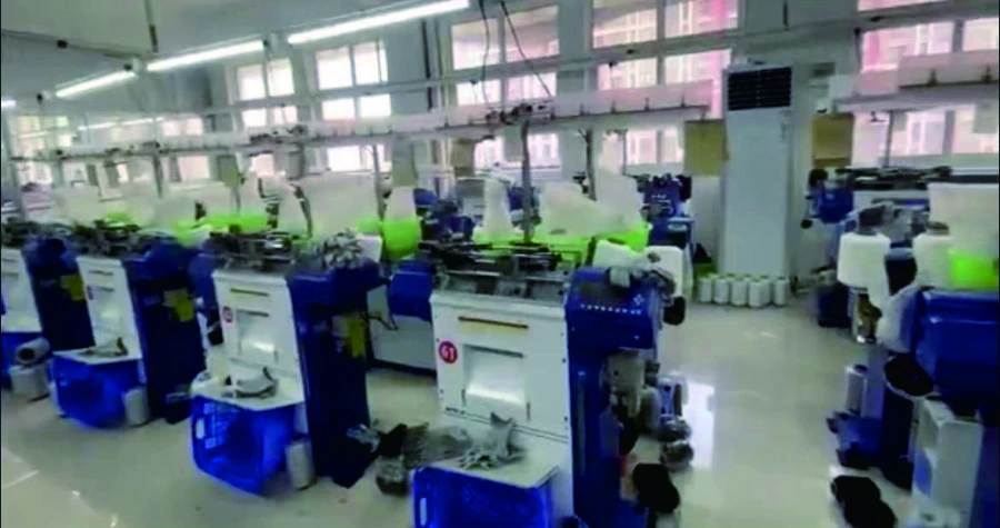 Knitting machines inside the glove factory